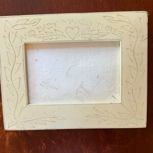 White wood engraved 5x7 frame “and baby makes three”.